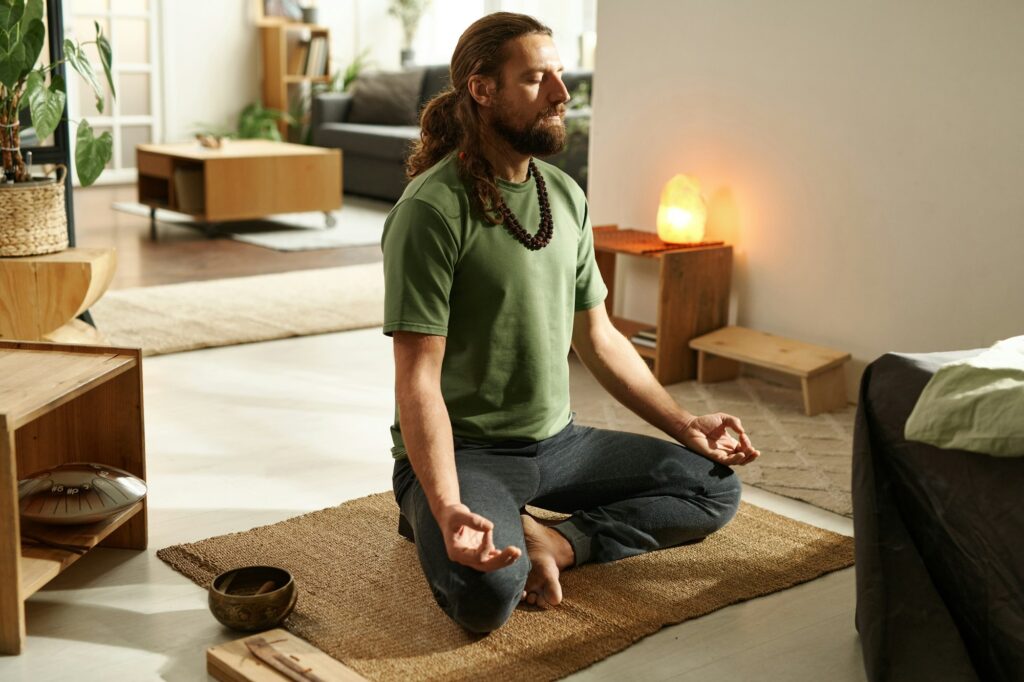 Man doing relaxation exercise at home