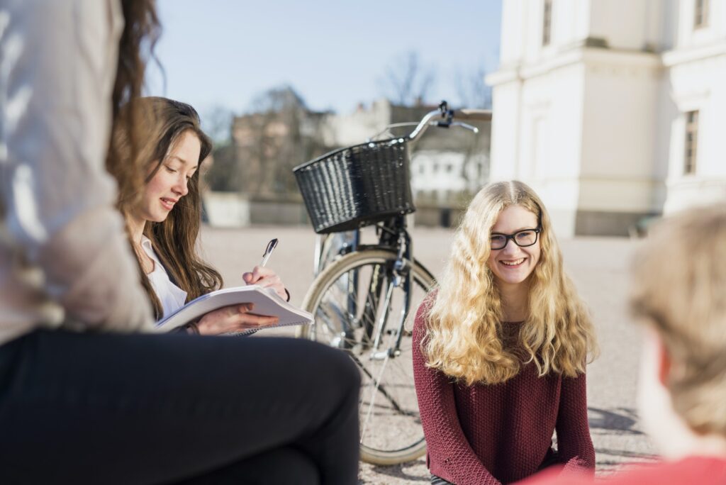 Teenage friends in college campus