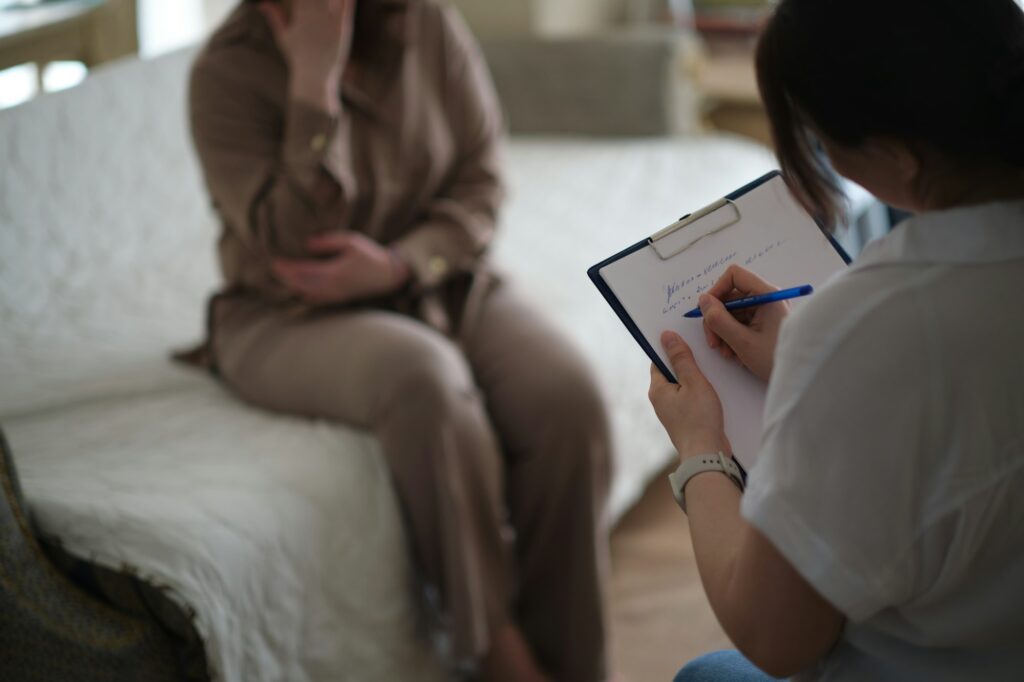 woman finds solace in the confidence and support of her therapist during a counseling session. The