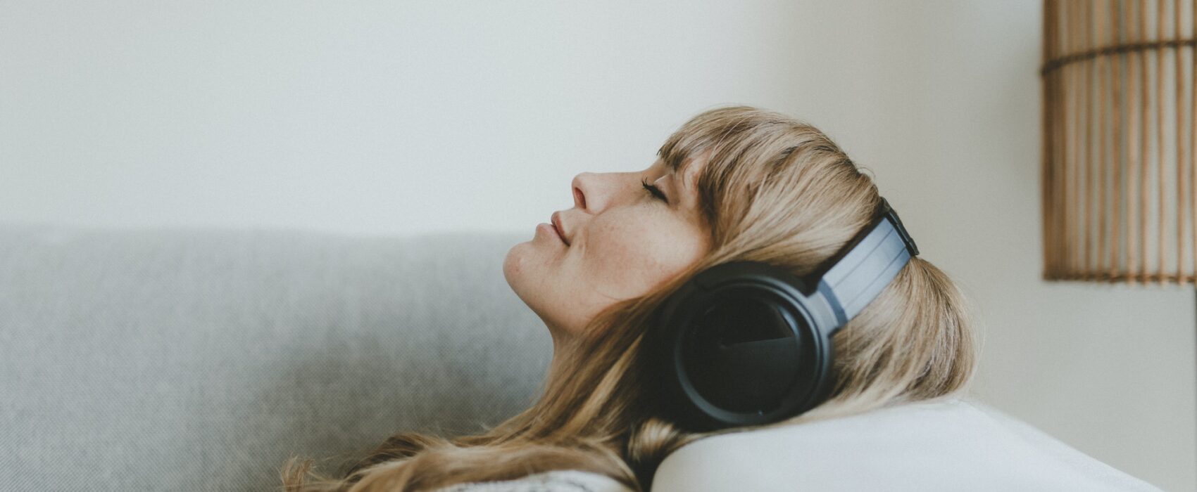 Woman listening to music, white tone