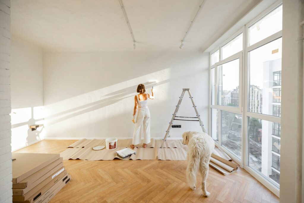 Woman with dog renovating house