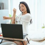 young Asian woman freelance working business work on laptop at home, working from home concept