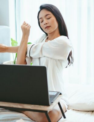 young Asian woman freelance working business work on laptop at home, working from home concept