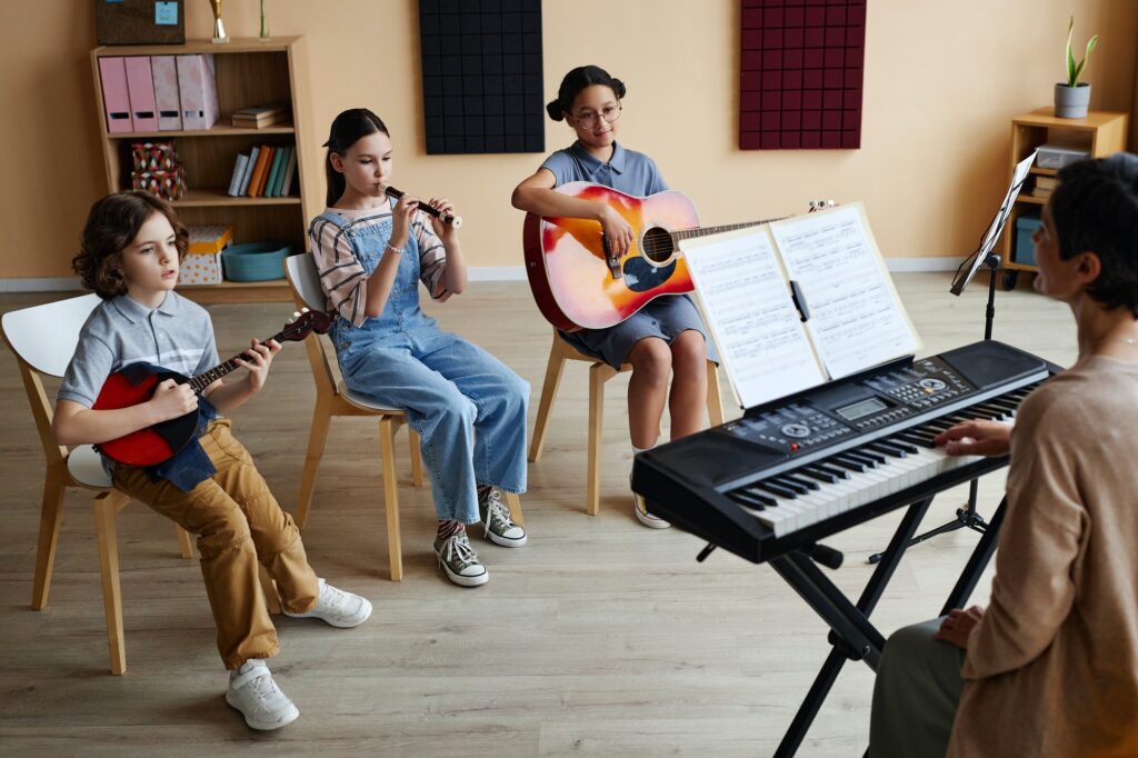 Children playing instruments in music class