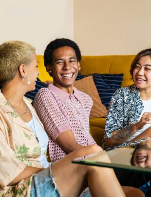 Group of friends bonding at home, LGBTQ and diversity concepts