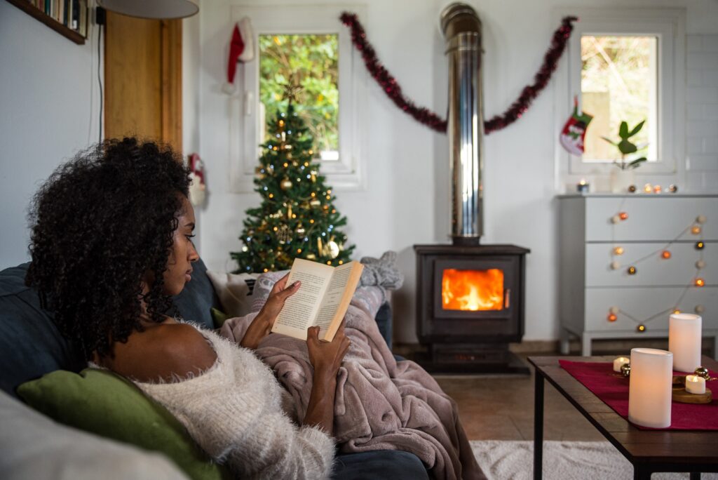 Woman reading book in cozy room