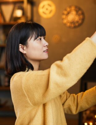 Young Woman Cleaning Home Side View