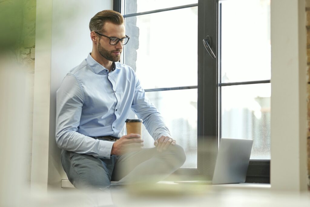 Attractive young manager working in the office alone