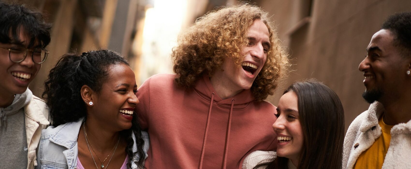 Group Of Happy Friends Having Fun Together Outdoors. Mixed race people laughing making community.