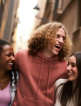 Group Of Happy Friends Having Fun Together Outdoors. Mixed race people laughing making community.