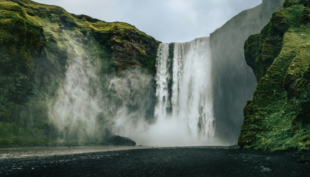 Landscape view of Skogafoss waterfall in cool colors, Skogar, Iceland